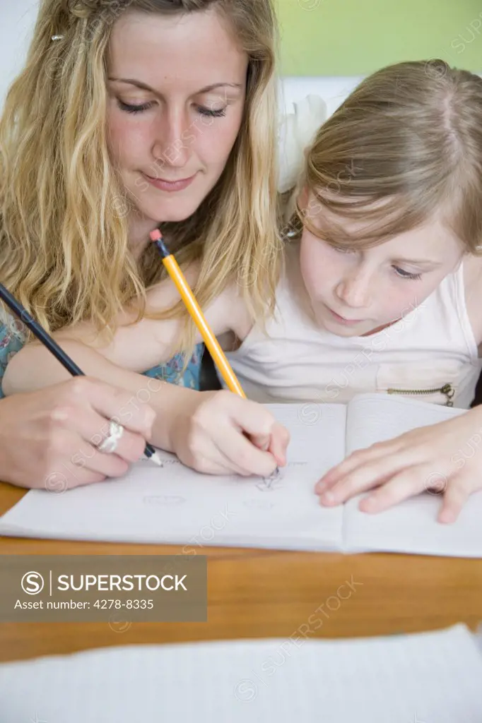 Mother and Daughter Doing Homework