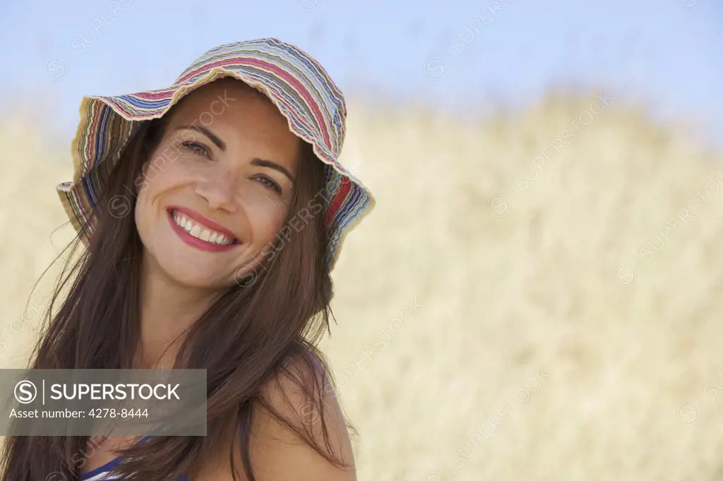Smiling Woman in Striped Hat