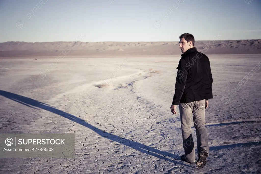 Man Walking in Desert Landscape