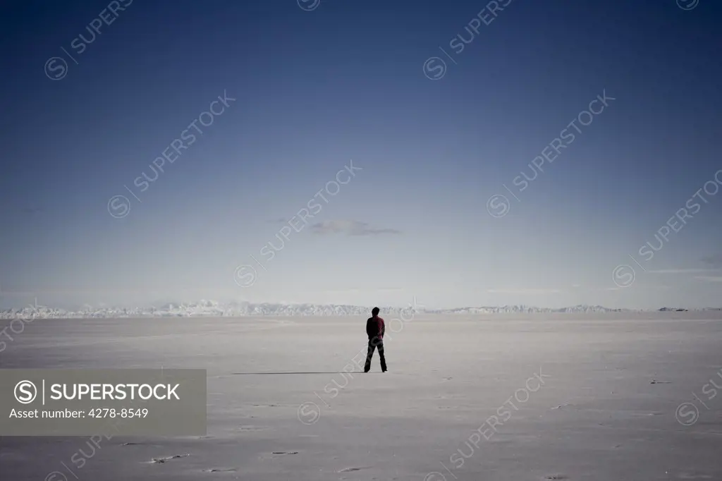 Man Standing In the Middle of Salt Flat