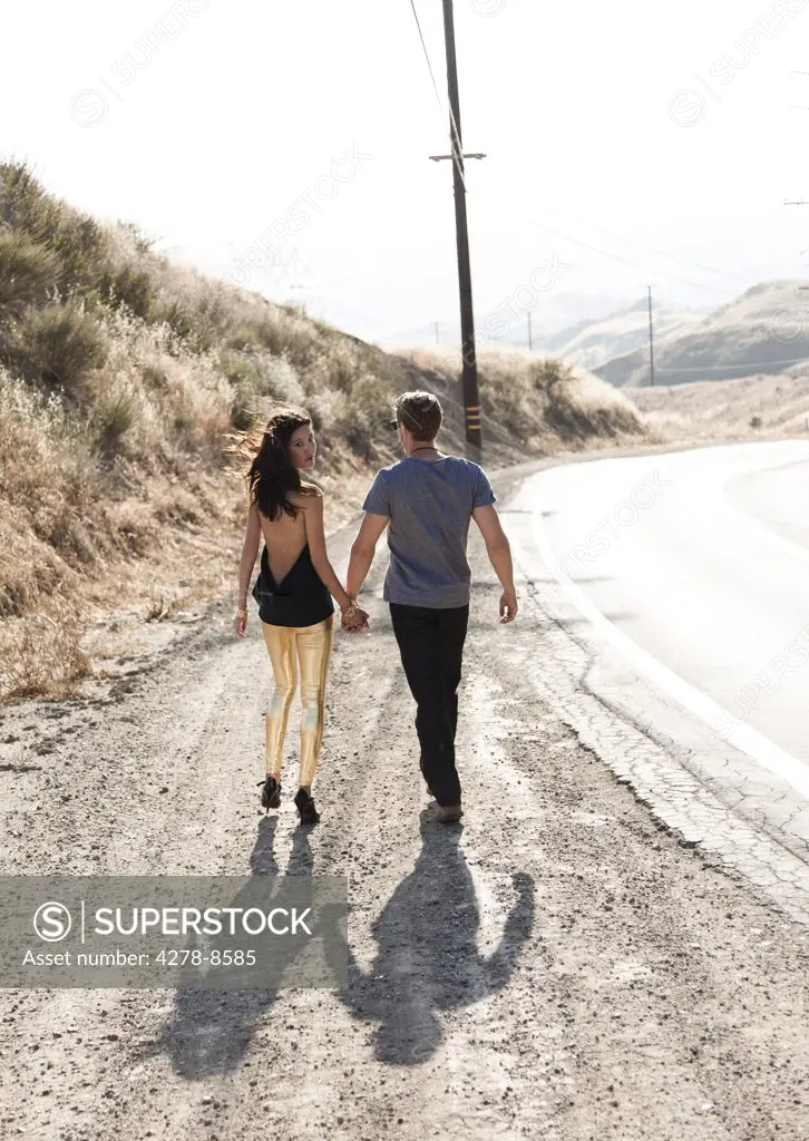 Couple Walking Down Deserted Road