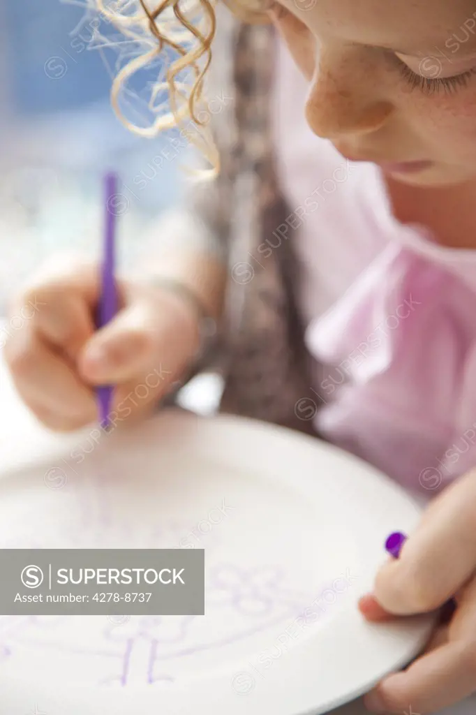 Girl Drawing on Ceramic Plate