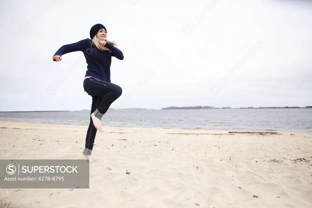Woman Running on Beach