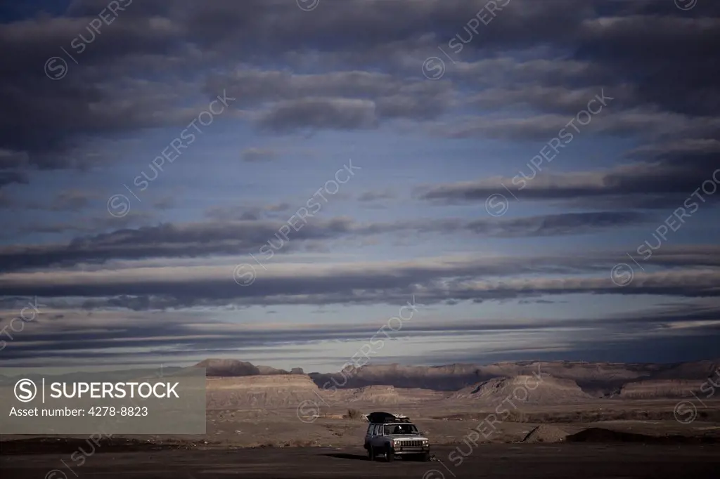 Car Parked on Remote Landscape
