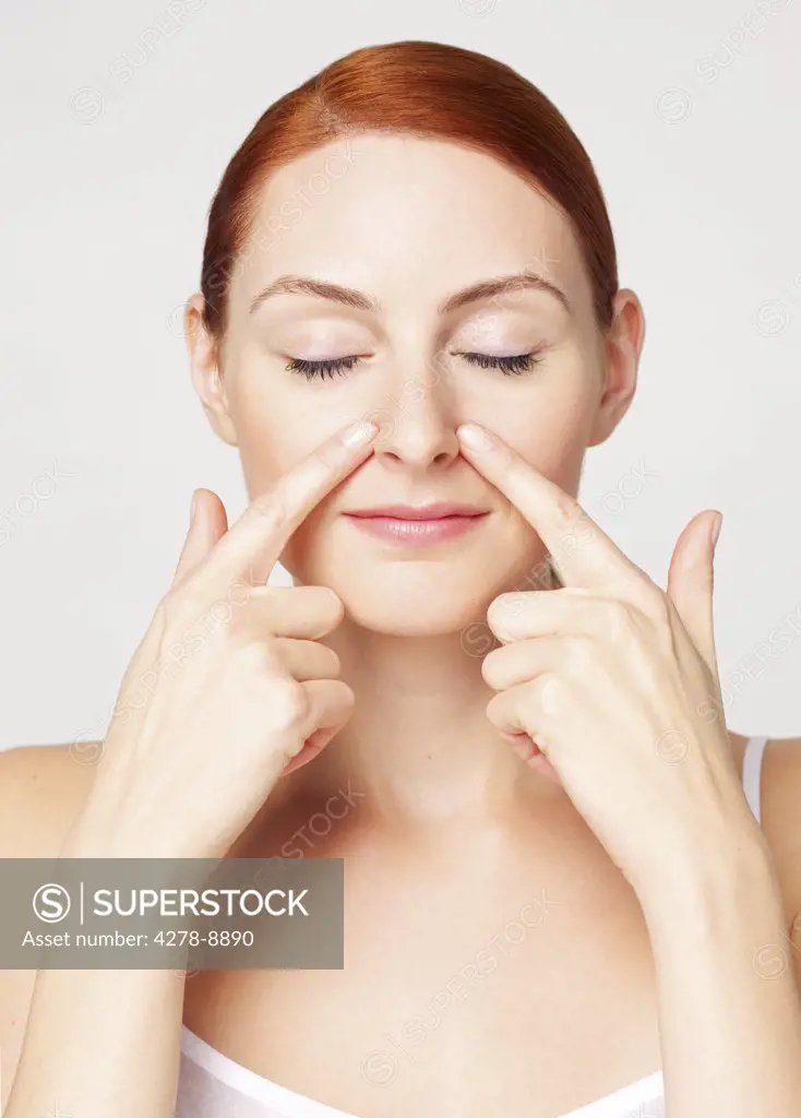 Woman with Fingertips on Side of the Nose