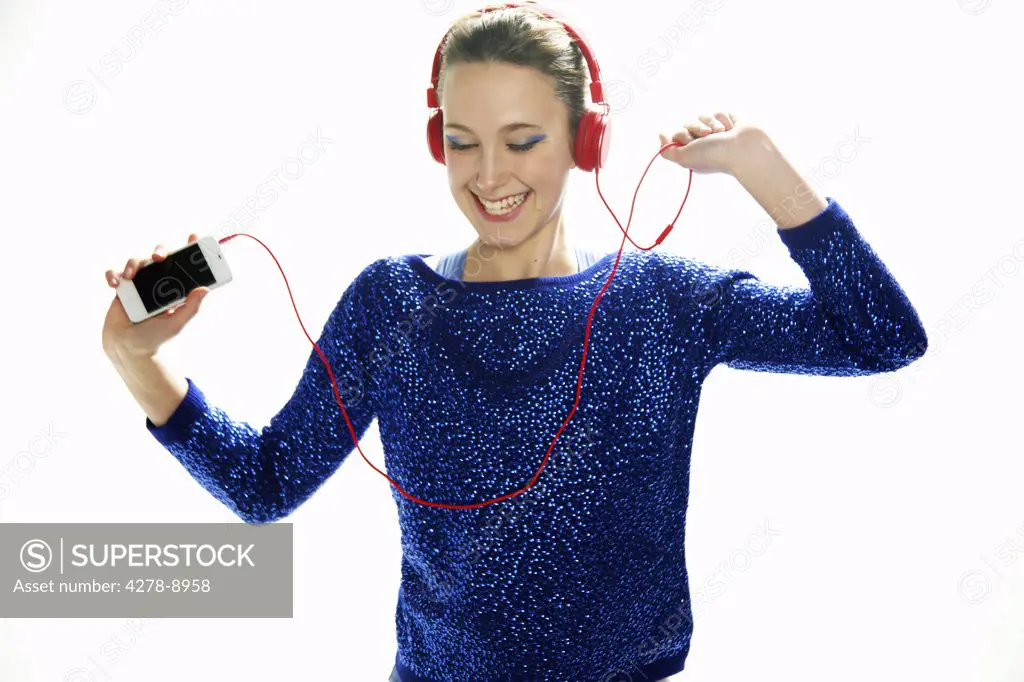 Teenage Girl with Headphones Dancing