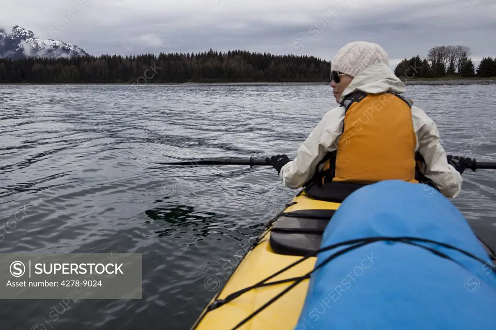 Back View of Woman Kayaking, Chatham Strait, Alaska, USA