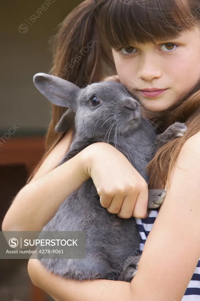 Girl Hugging Grey Rabbit