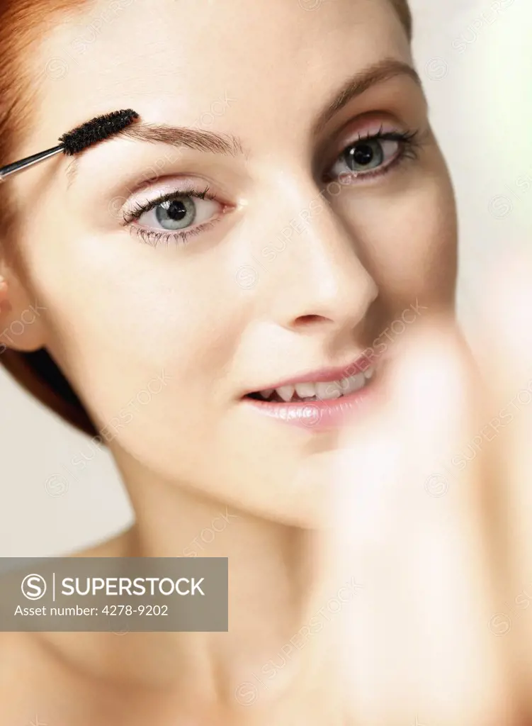 Woman Using Eyebrow Brush