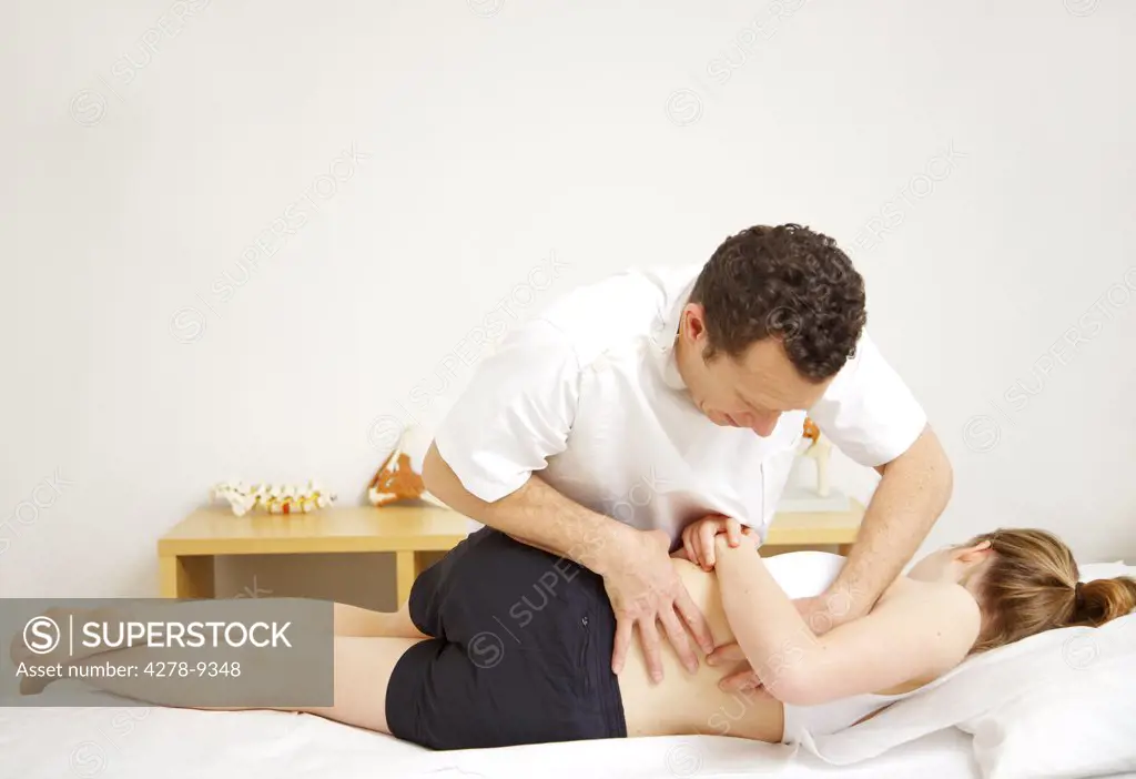 Osteopath Treating Female Patient