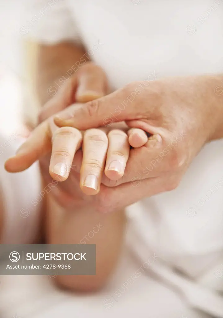 Osteopath Treating Woman's Wrist, Close up view