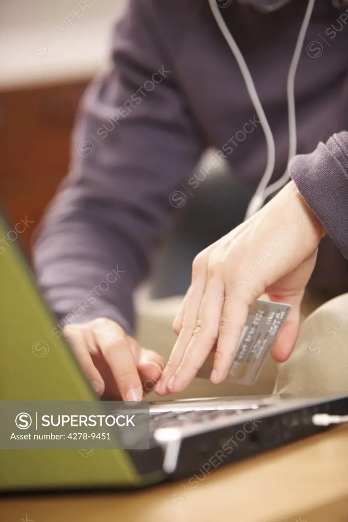 Man Shopping Online with Credit Card, Close up view