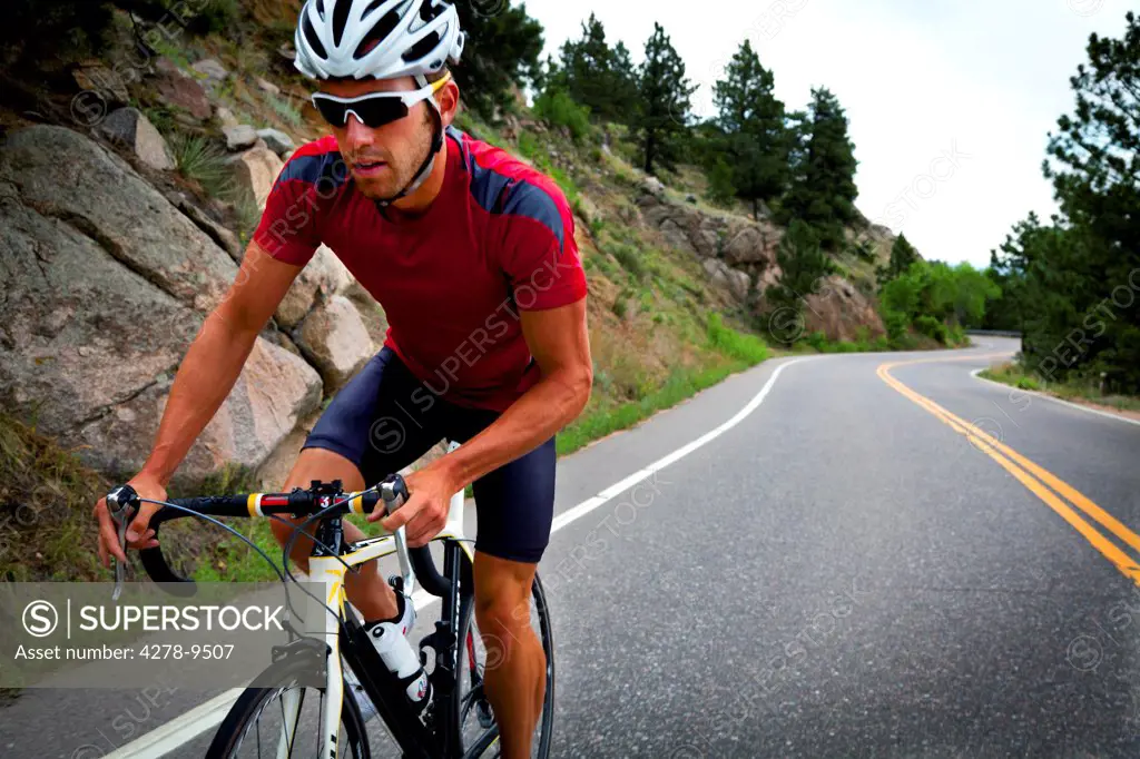 Cyclist Riding Bike on Road