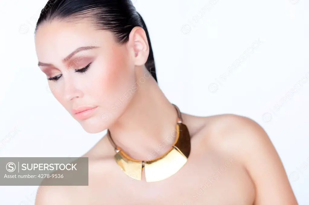 Portrait of Woman Wearing Gold Necklace