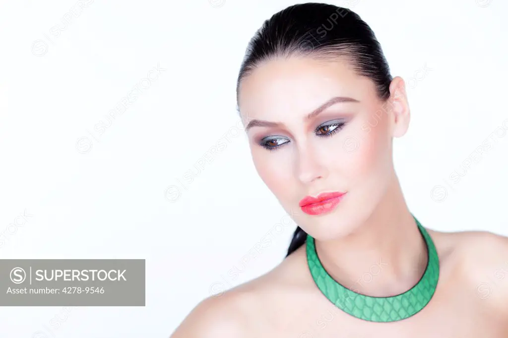 Woman Wearing Red Lipstick and  Green Necklace