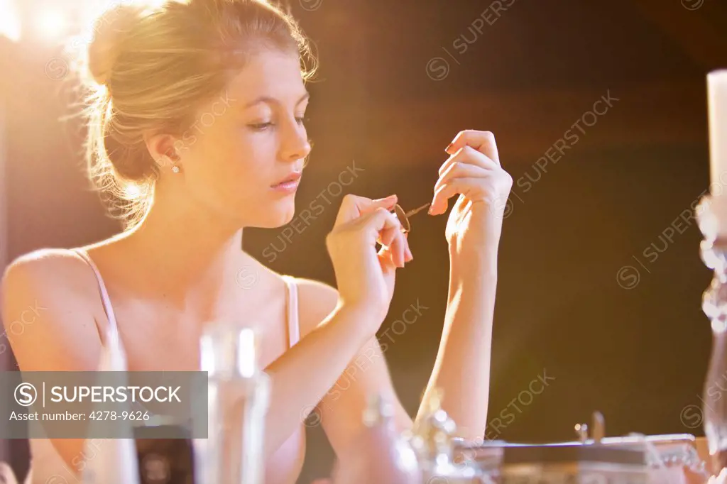Young Woman Applying Nail Polish