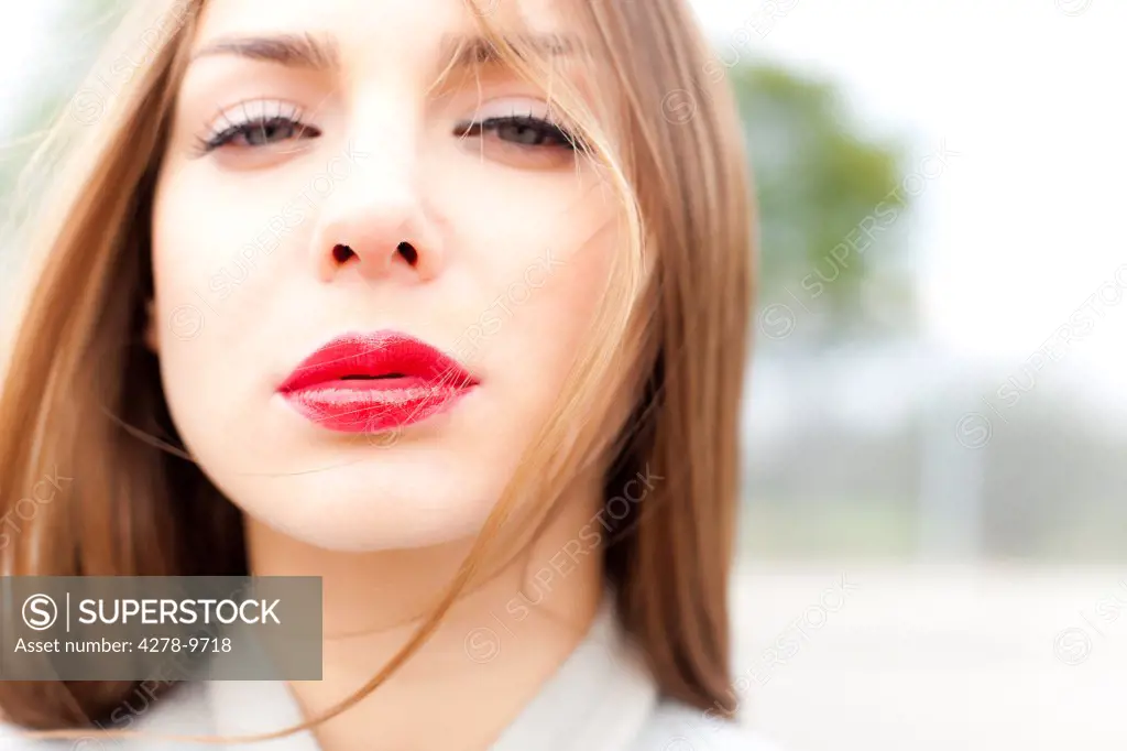 Close up of Young Woman Wearing Red Lipstick