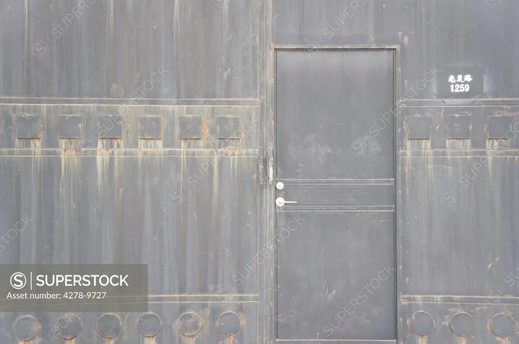 Closed Door on Gray Building in China