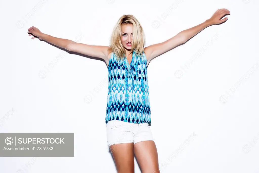 Smiling Woman with Arms Outstretched