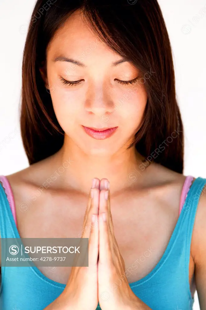 Young Woman with Hands in the Prayer Position