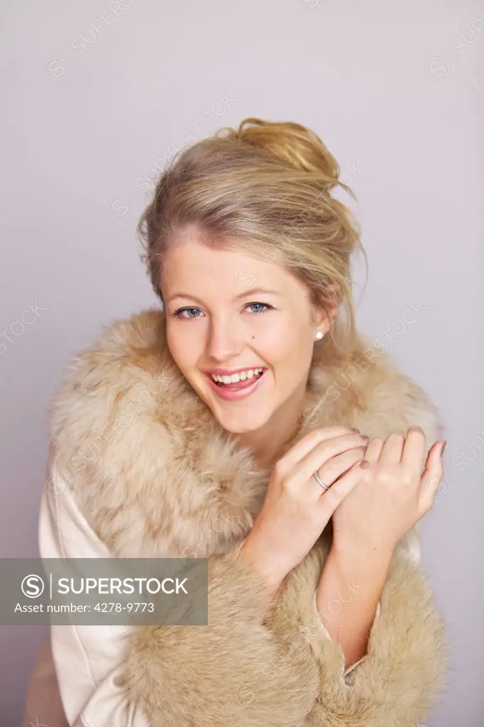 Smiling Woman in Fur Trim Coat