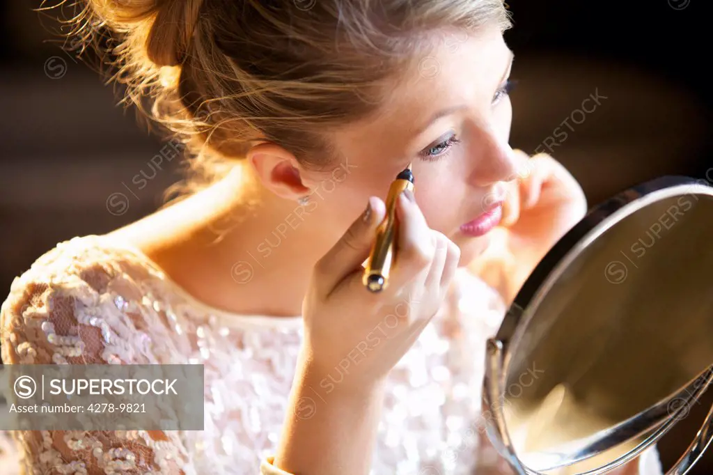 Young Woman Applying Concealer