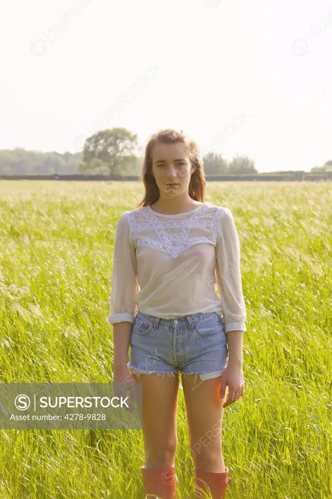 Young Woman Standing in a Field