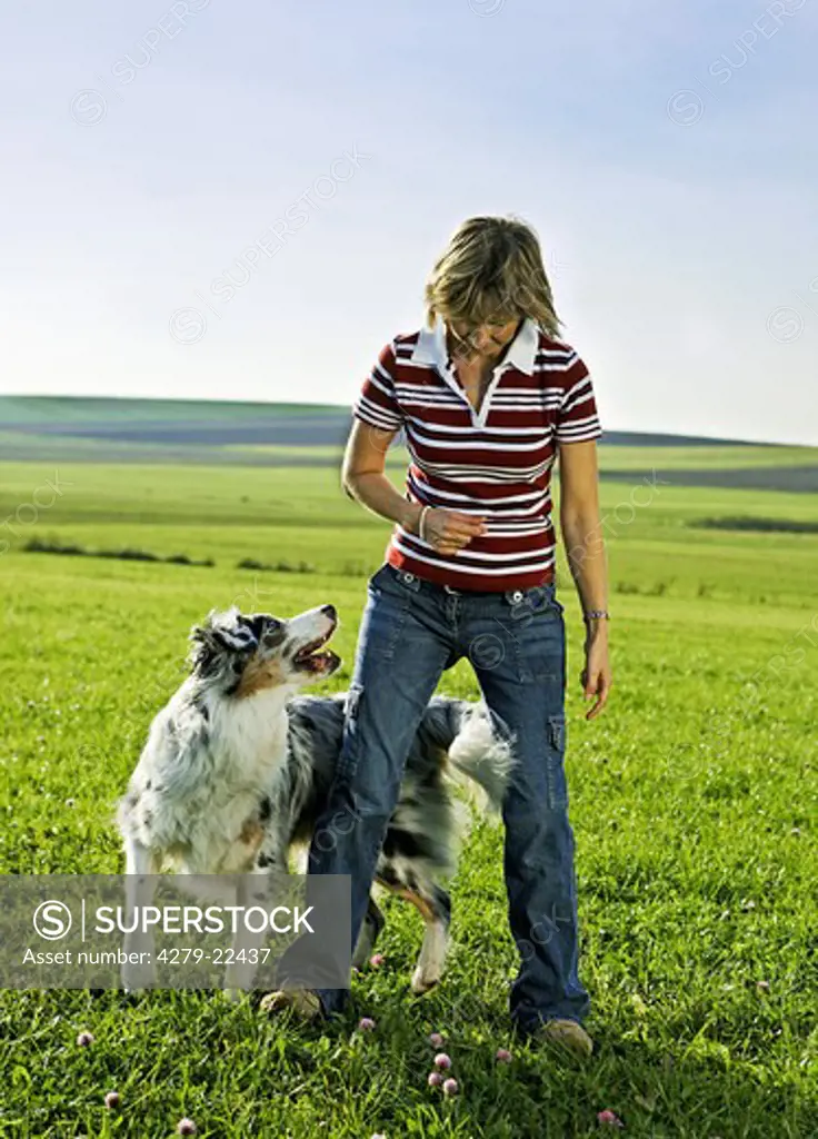 woman and Australian Shepherd