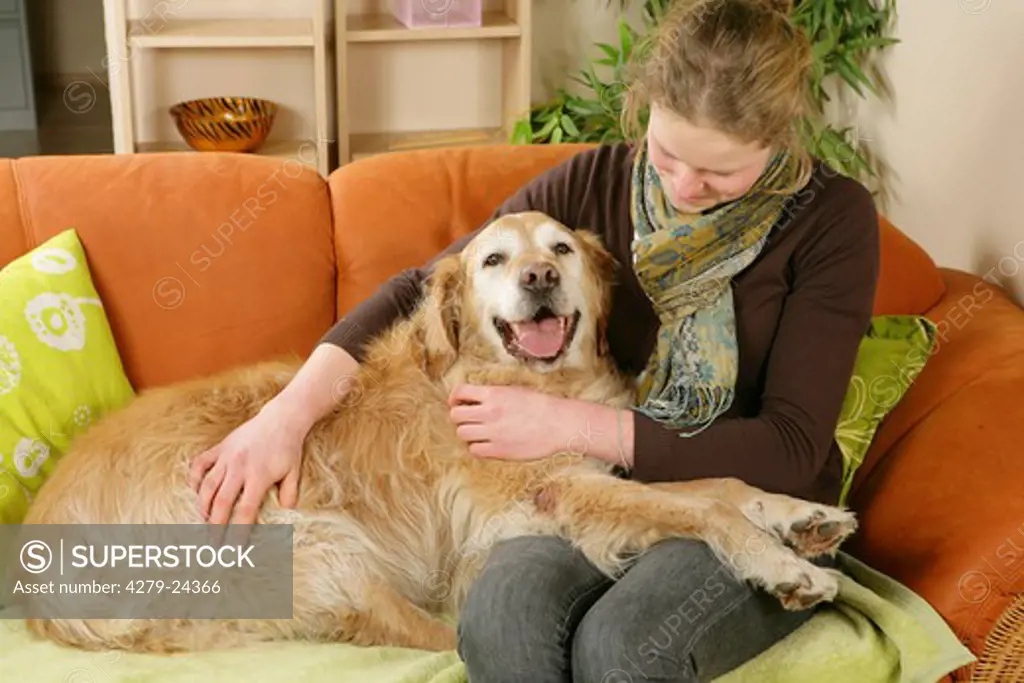 woman and old Golden Retriever