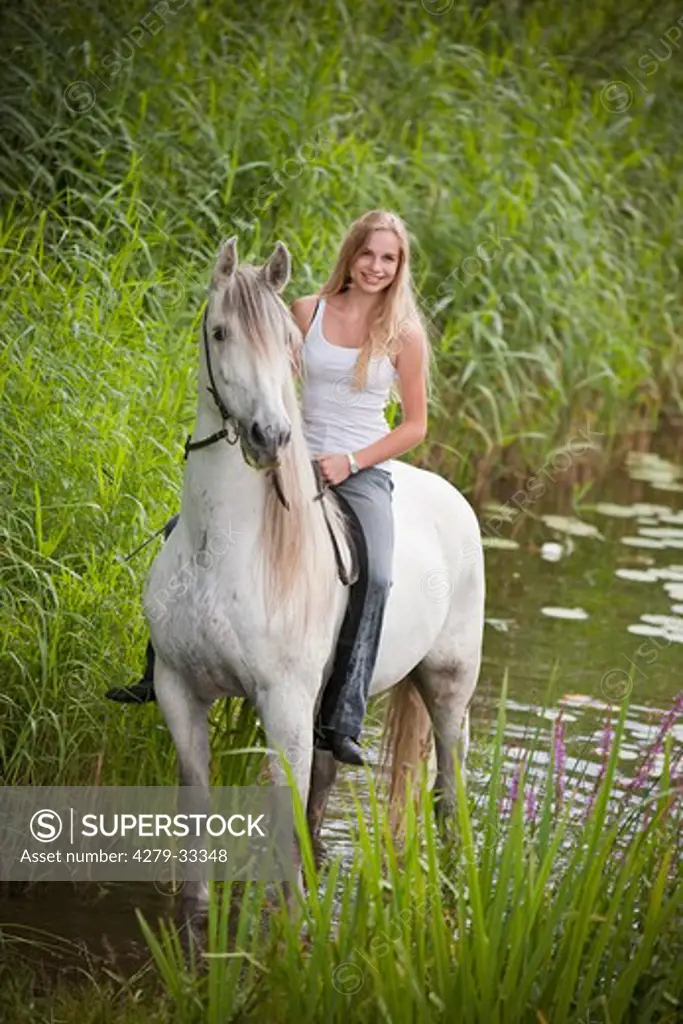 young woman on Pure Spanish-bred horse