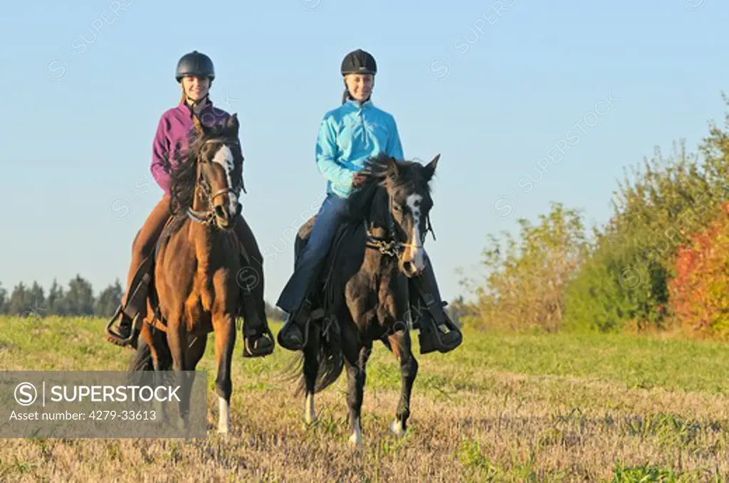 two young woman riding on Paso Fino horses