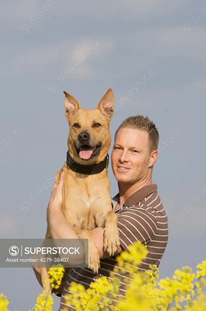 man and half breed dog