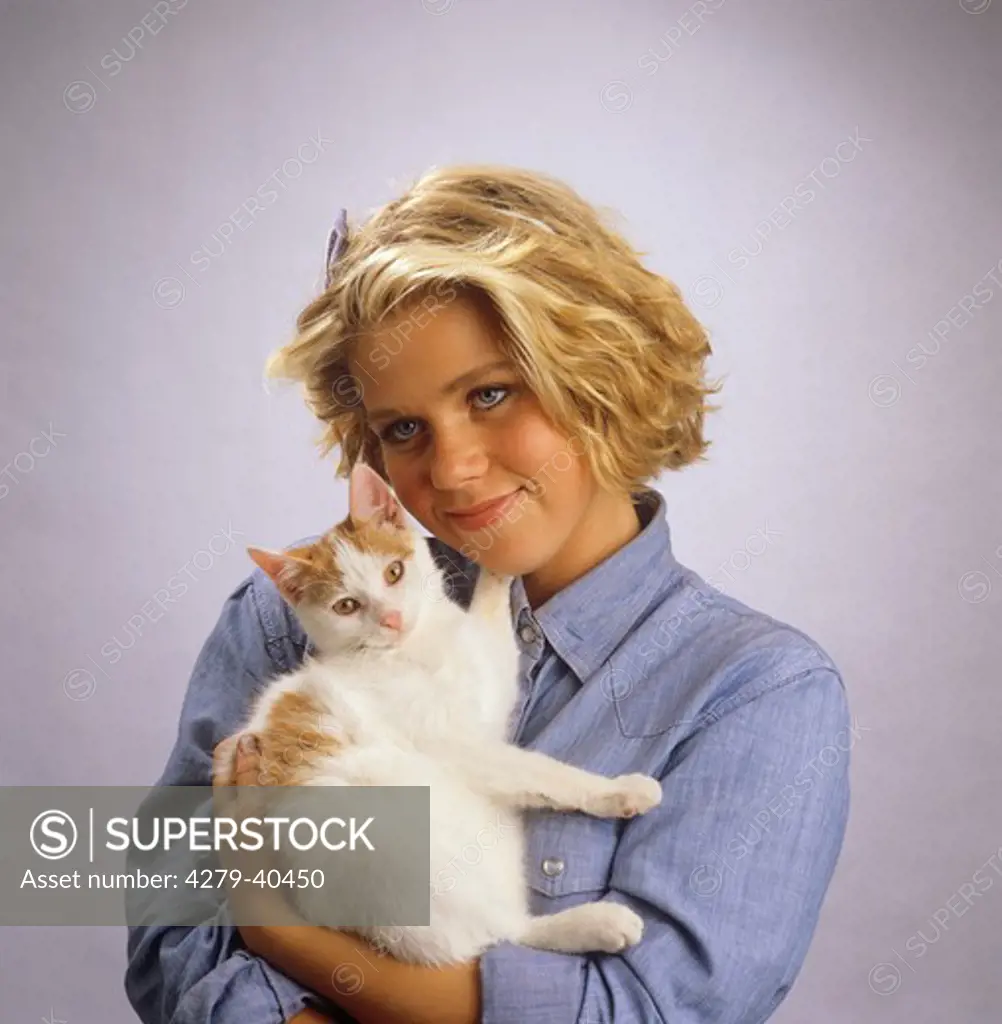 girl with cat on her arms
