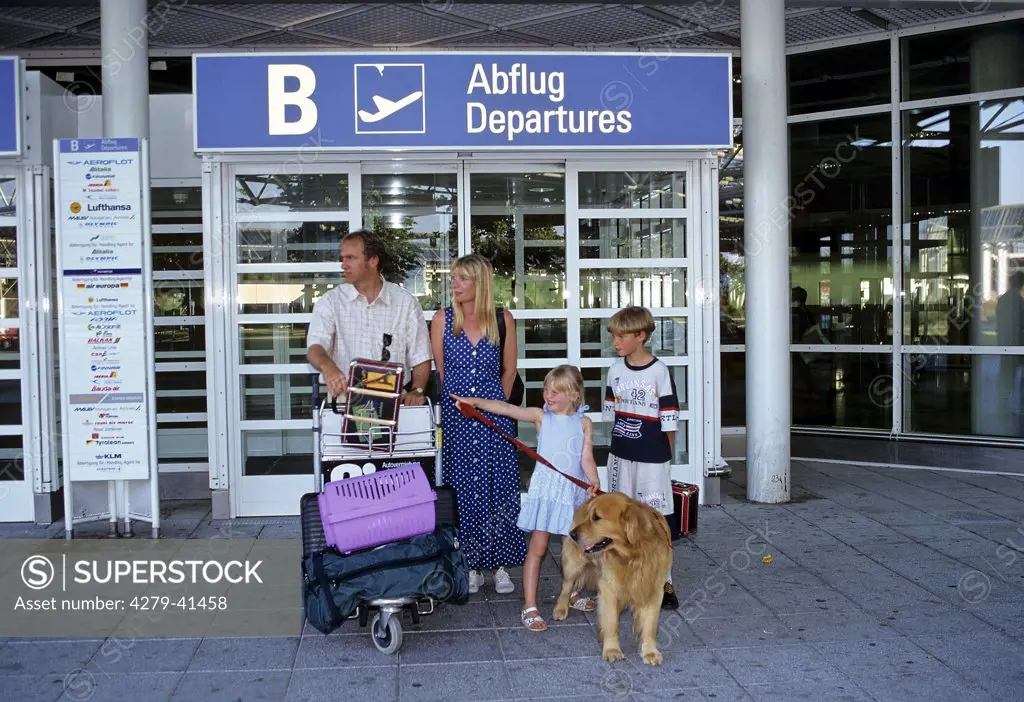 family with dog and cat at the airport