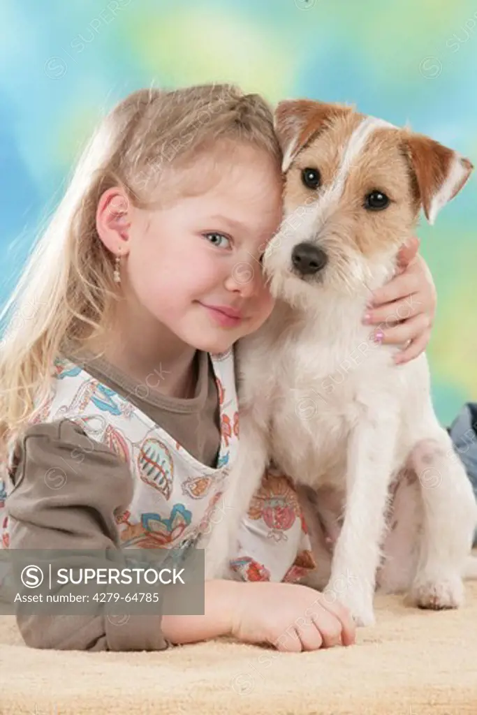 Young girl with mixed-breed dog, portrait