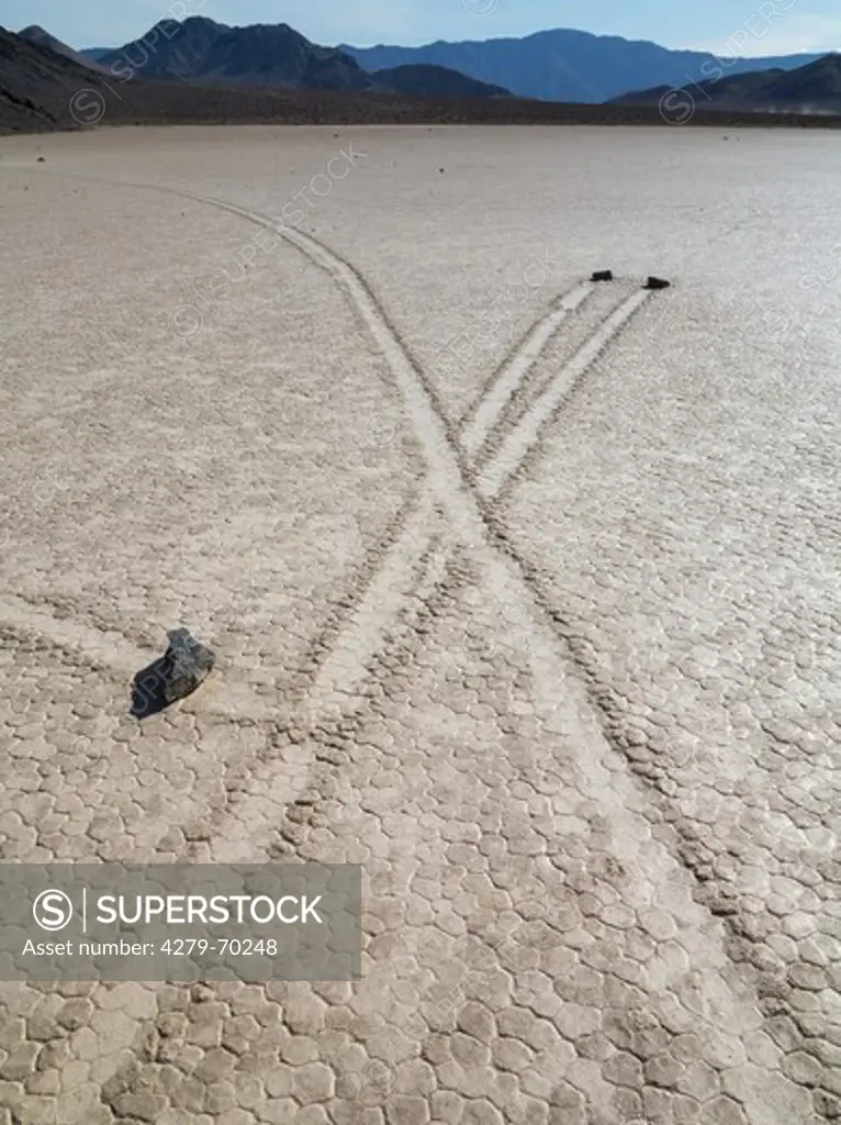 Tracks created by the mysterious moving rocks at the Racetrack. The Racetrack is a dry lakebed - a so-called playa - in the remote northern Death Valley. Death Valley National Park, California, USA