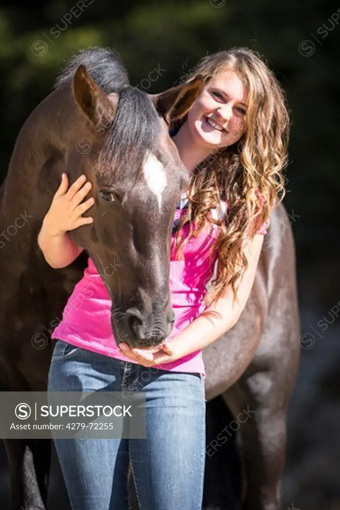 Kaimanawa Horse. Young woman with a chestnut gelding. New Zealand