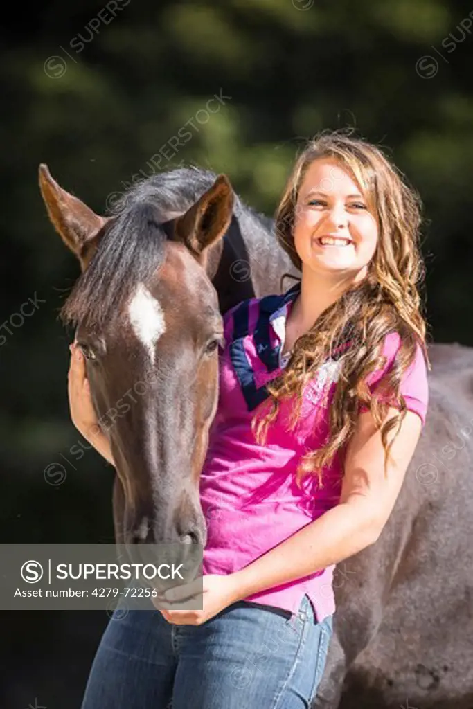 Kaimanawa Horse. Young woman with a chestnut gelding. New Zealand
