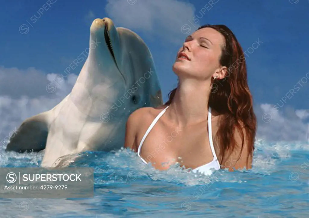 woman beside bottlenosed dolphin, Tursiops truncatus