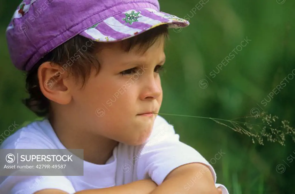boy with blade of grass