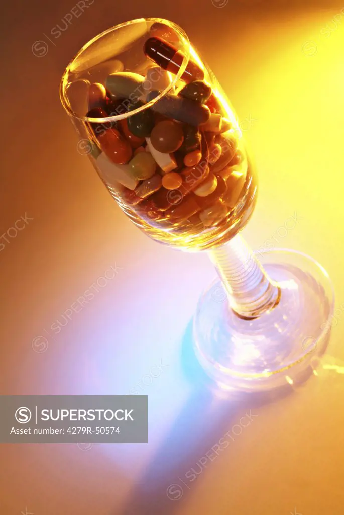 glass with different pills