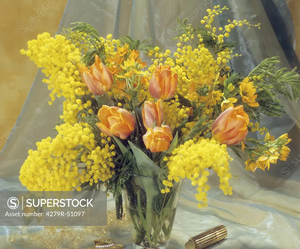 bouquet with mimosas , tulips and sun star