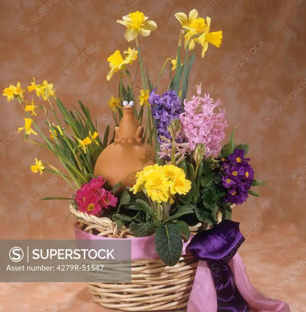 basket with different flowers