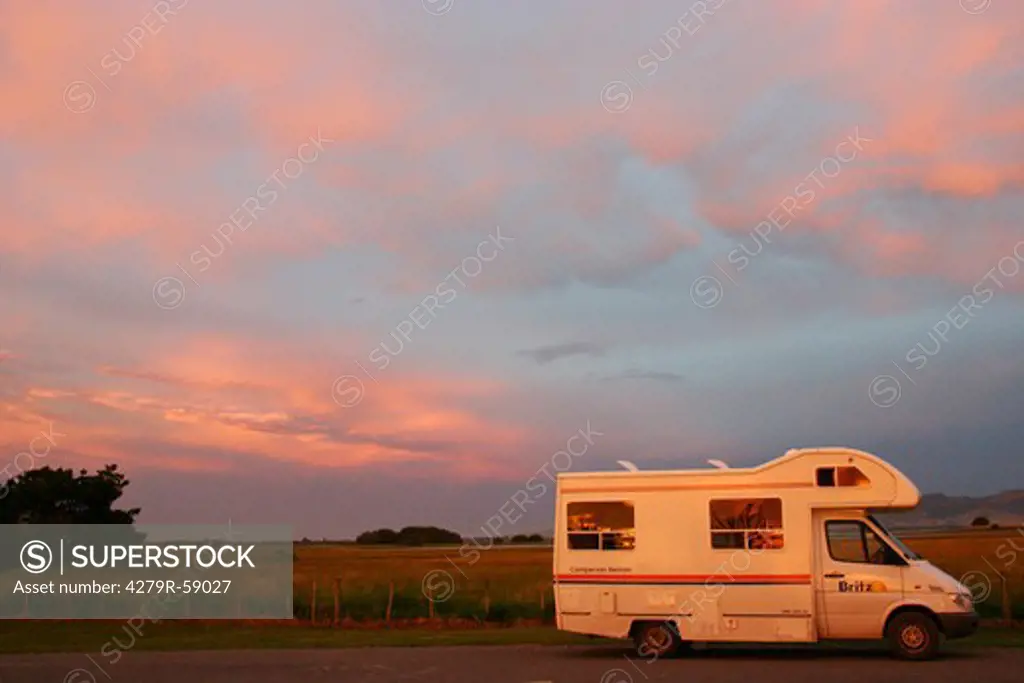 New Zealand, camper in front of evening sky
