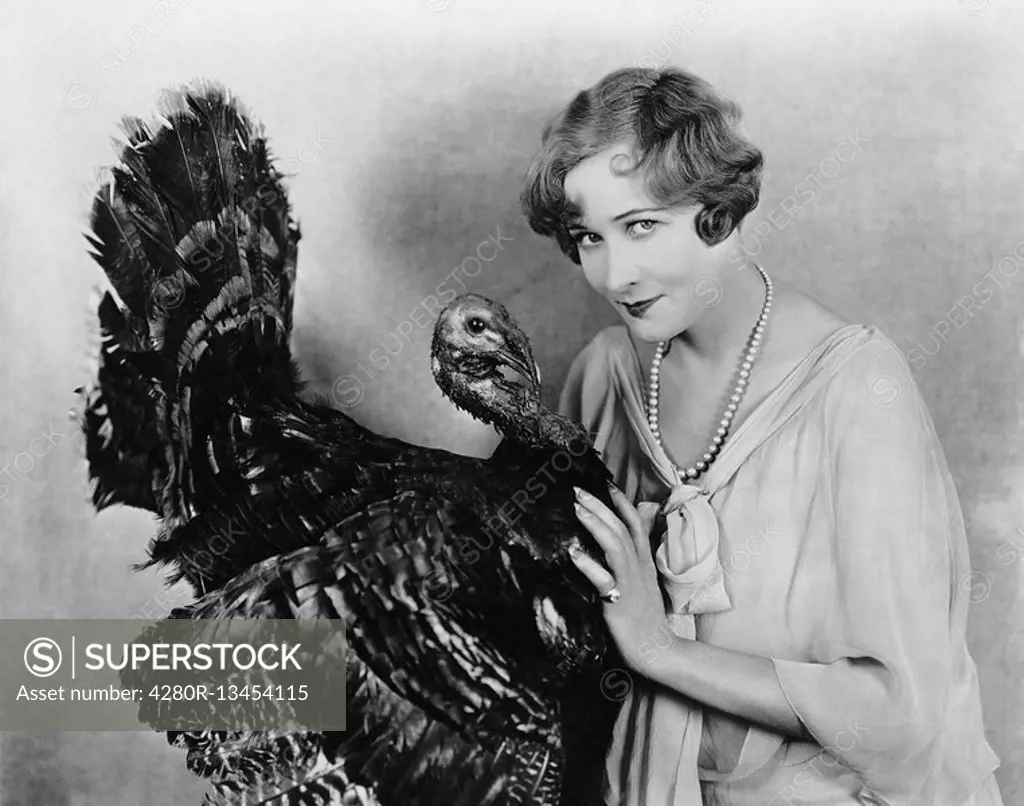 Portrait of woman with live turkey All persons depicted are not longer living and no estate exists Supplier warranties that there will be no model rel...