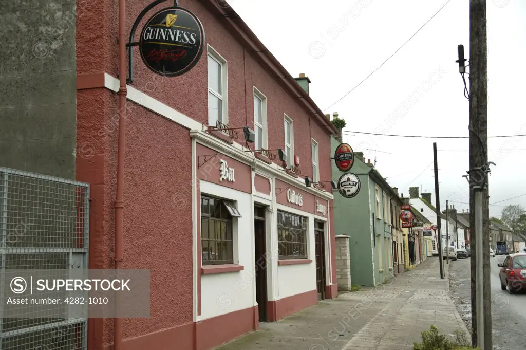 Republic of Ireland, County Cork, Kiltha. A traditional Irish pub frontage in the suburbs of Cork.