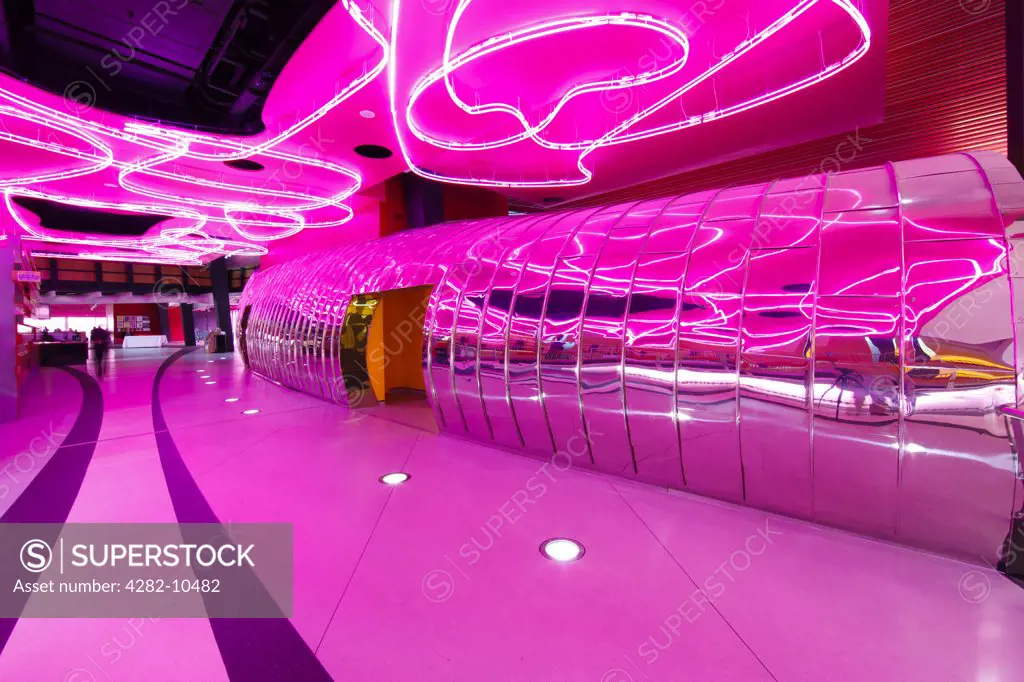 England, West Midlands, West Bromwich. Bright pink interior of The Public, a new multi-purpose participatory art gallery in West Bromwich, designed by Will Alsop Architects.