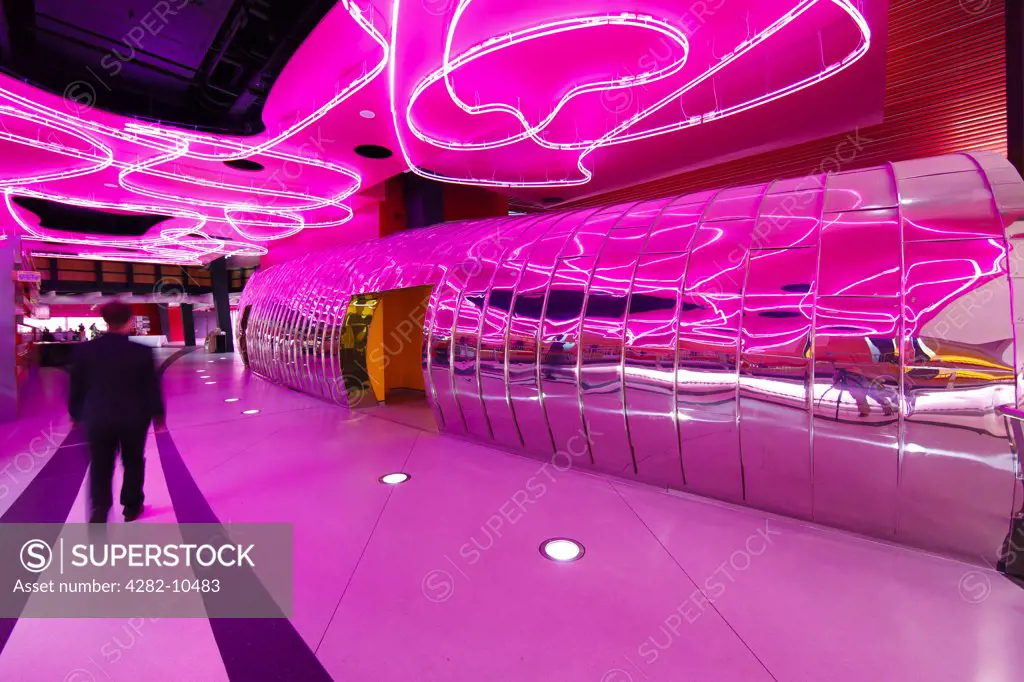 England, West Midlands, West Bromwich. Bright pink interior of The Public, a new multi-purpose participatory art gallery in West Bromwich, designed by Will Alsop Architects.