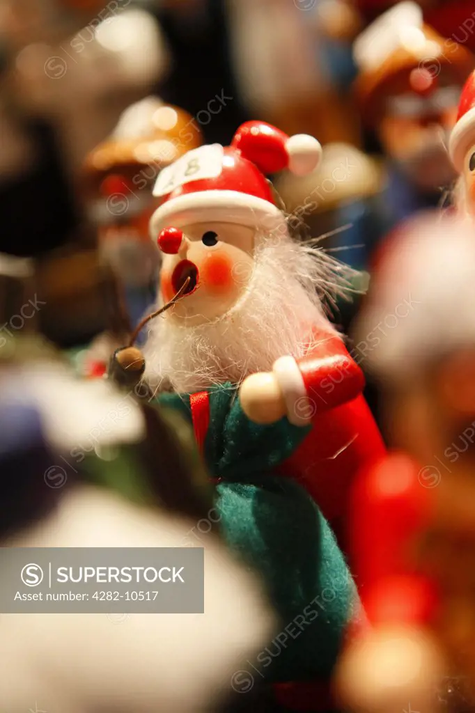 England, West Midlands, Birmingham. A close-up of a hand made Father Christmas toy on a stall at the annual Birmingham Frankfurt Christmas Market.