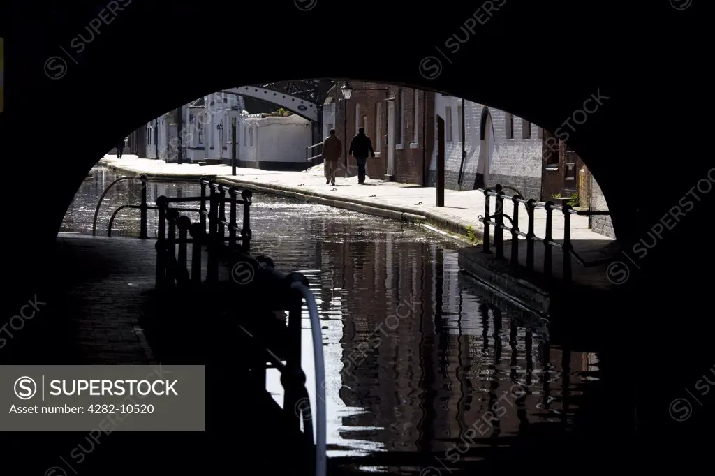 England, West Midlands, Birmingham. A canal path under a bridge leading to Gas Street Basin, Birmingham.